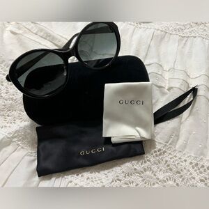 Gucci Elegant Black Eyewear with White Pouch